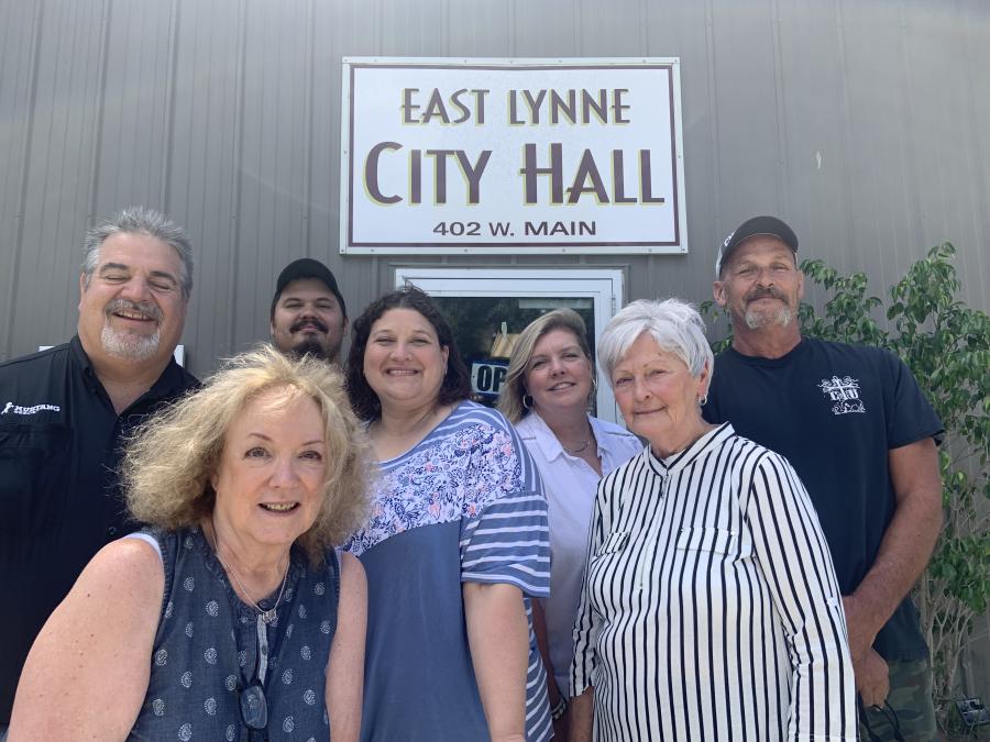MARC Staff in selfie with staff members in front of East Lynne City Hall.