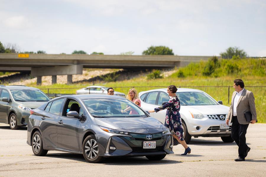 Commuters walking to a vehicle for carpooling