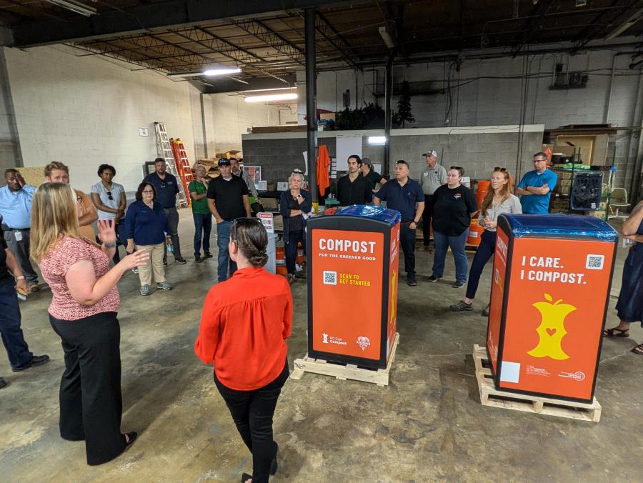 KC Compost staffers brief tour delegation on upcoming smart composting kiosk program