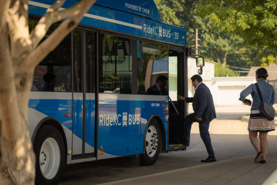 Two passengers boarding a Ride KC bus