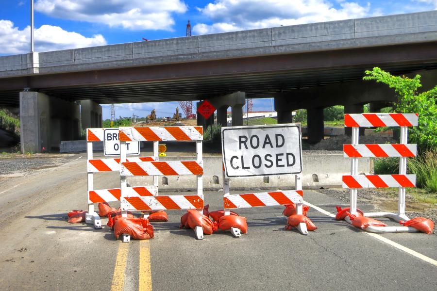 Road closed traffic sign on road