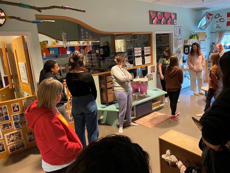 Early learning educators tour each other's classrooms