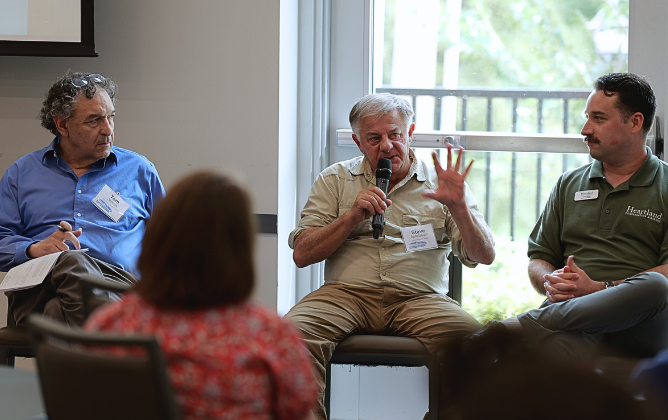 Panelists expressively answering questions to audience