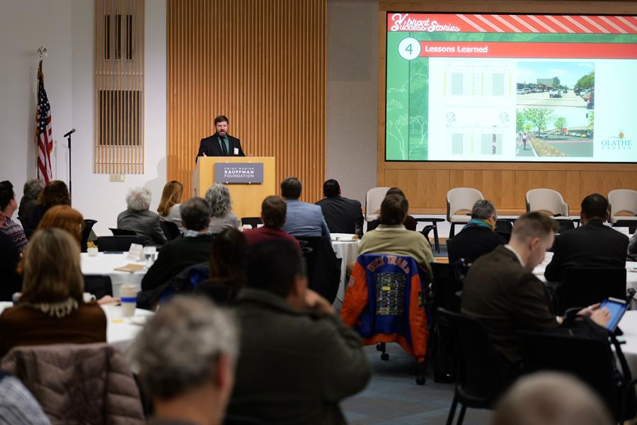 A speaker announcing an award winner at the during the 2025 Vibrant Success Stories event