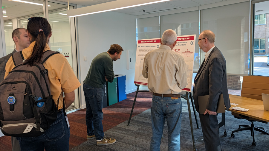 People looking at Smart Moves boards at the Transportation & Environment open house